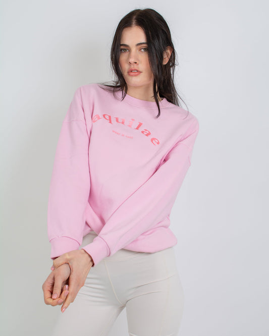 A stylish model rocks a pink women’s sweatshirt and shorts, exuding a cool and casual vibe. Fashion-forward and effortlessly chic!